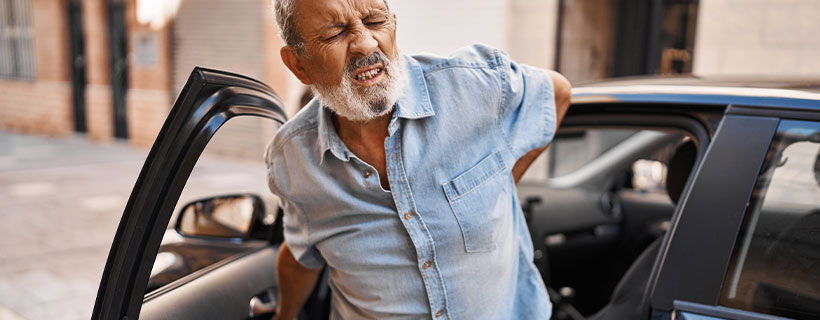 patient with back pain in need of auto accident injury care in Lexington