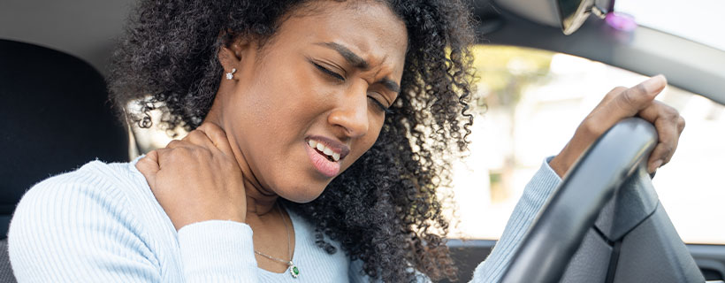 patient with neck pain in need of auto accident injury care in Lexington